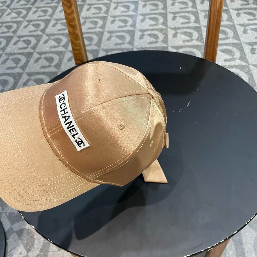 CHANEL BASEBALL HAT IN GOLD SILK SATIN 404866